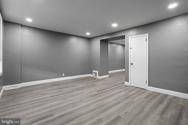 unfurnished room featuring light hardwood / wood-style floors