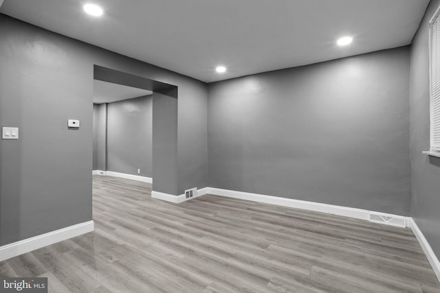 spare room featuring light hardwood / wood-style floors