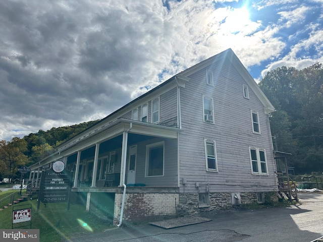 view of home's exterior with a porch