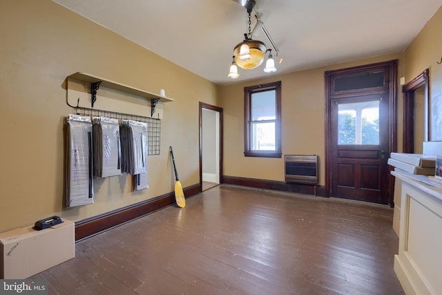 foyer featuring dark wood-type flooring and heating unit