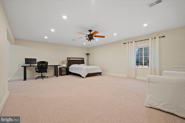 bedroom featuring ceiling fan and light colored carpet