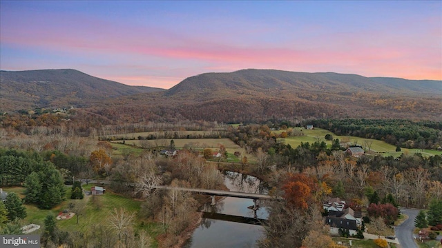 view of mountain feature with a water view