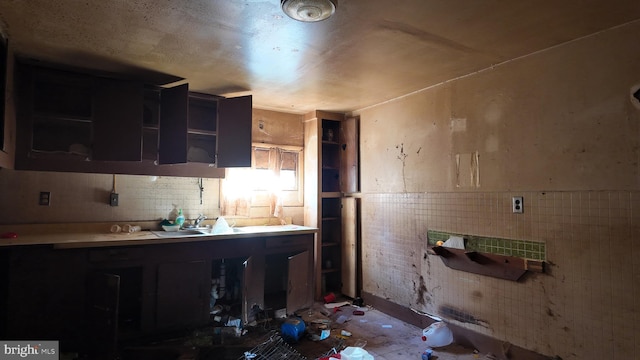 kitchen featuring tile walls