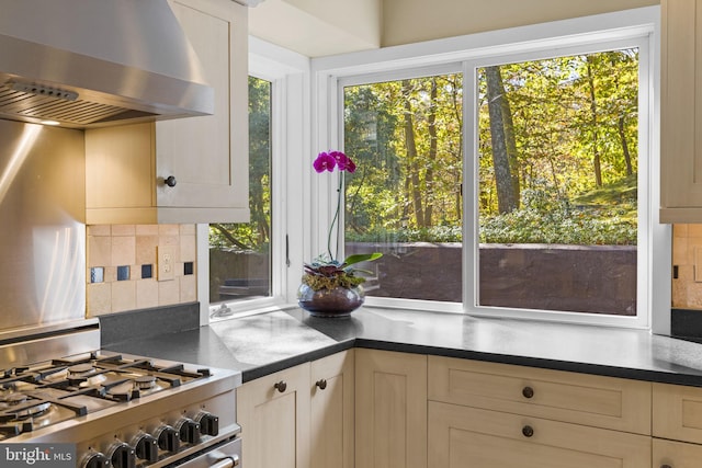 6503 Fleecydale Rd, New Hope, PA 18938 - kitchen featuring backsplash, wall chimney exhaust hood, gas stove, and a wealth of natural light