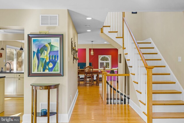 6503 Fleecydale Rd, New Hope, PA 18938 - stairs with baseboards, wood finished floors, visible vents, and recessed lighting