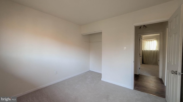 unfurnished bedroom with light wood-type flooring