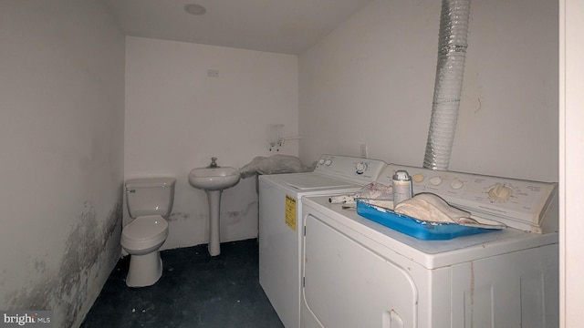 washroom with separate washer and dryer