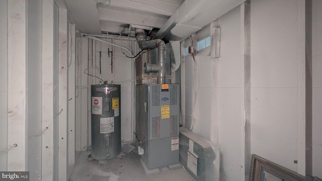 utility room featuring water heater