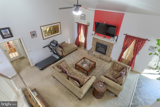 living room with carpet flooring, a fireplace, high vaulted ceiling, and ceiling fan