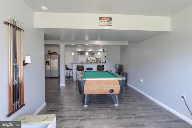 recreation room featuring billiards, dark hardwood / wood-style flooring, and bar area