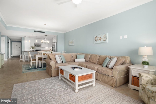 tiled living room with crown molding and ceiling fan with notable chandelier