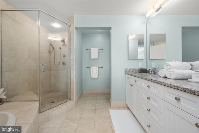 bathroom with vanity and a shower with shower door