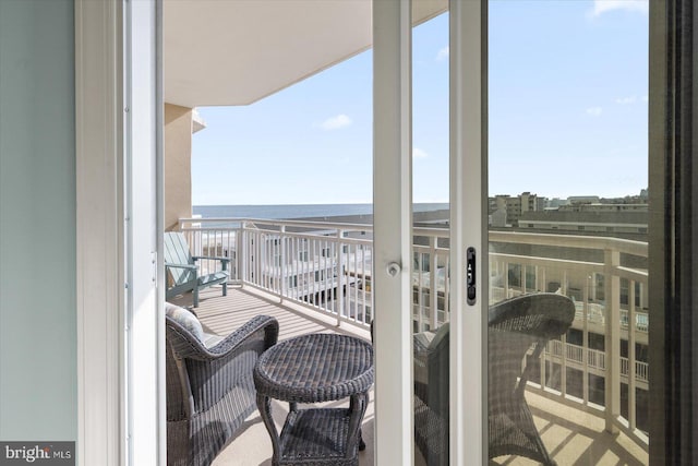 balcony featuring a water view