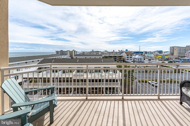 balcony featuring a water view