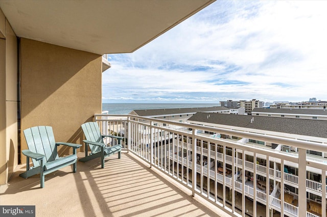 balcony featuring a water view