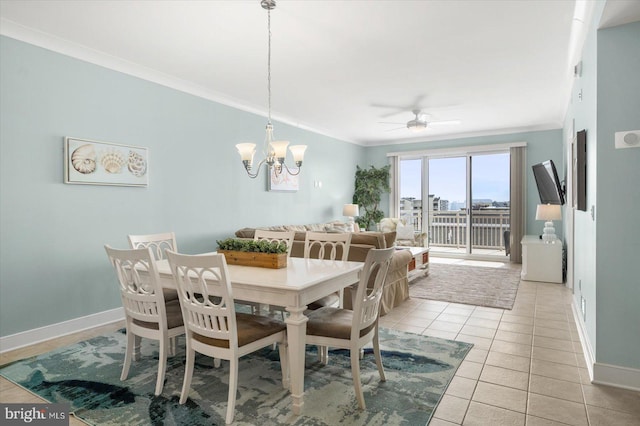 dining room featuring ornamental molding, light tile patterned floors, and ceiling fan with notable chandelier