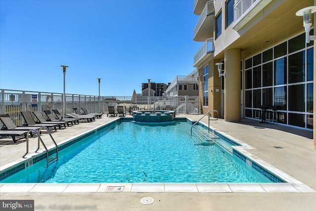 view of pool featuring a patio