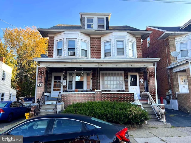 townhome / multi-family property with covered porch