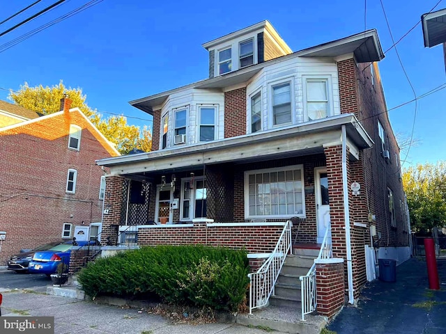 view of property featuring a porch