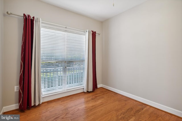 spare room featuring light wood-type flooring