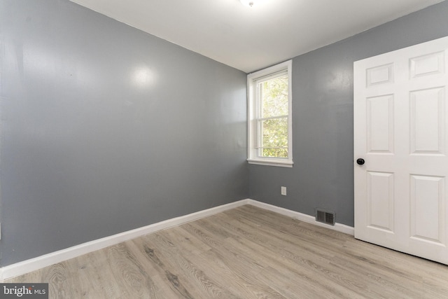 unfurnished room with light hardwood / wood-style floors