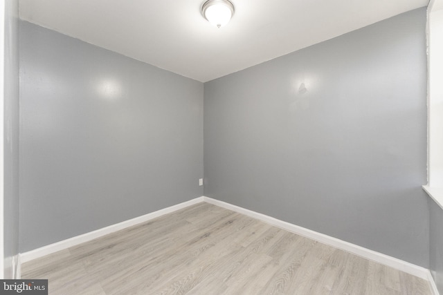 unfurnished room with light hardwood / wood-style floors