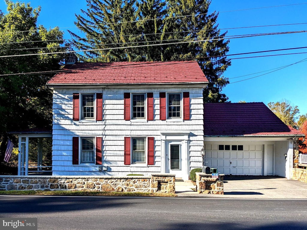 colonial inspired home with a garage