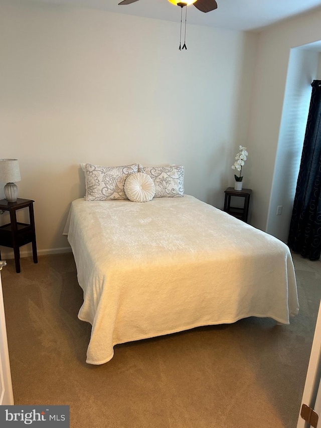 bedroom featuring ceiling fan and carpet flooring