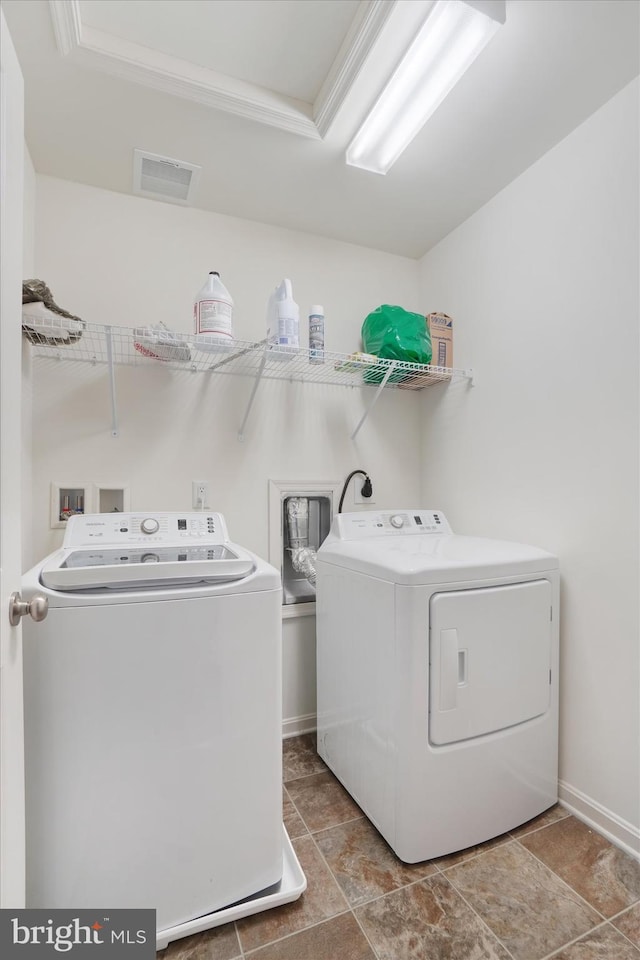 laundry room with separate washer and dryer