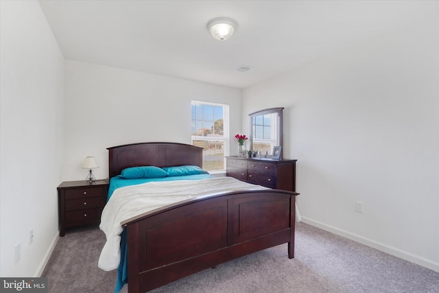 bedroom with light carpet