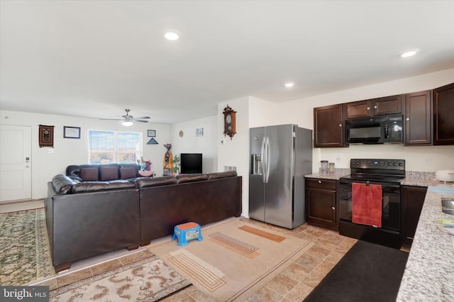 kitchen with black appliances, light stone counters, dark brown cabinets, and ceiling fan