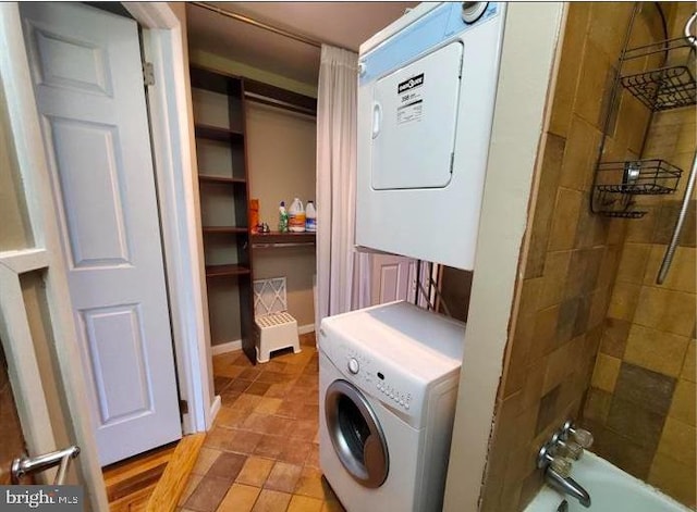 laundry room featuring stacked washer and dryer