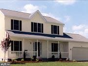 view of front of property featuring a porch and a garage