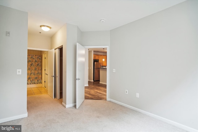 hallway featuring carpet flooring