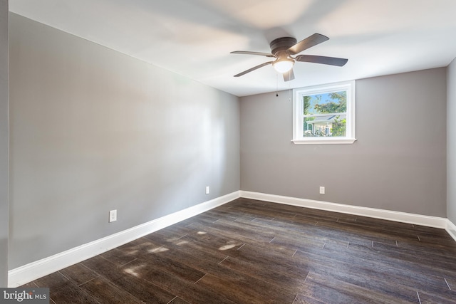 unfurnished room with dark wood-type flooring and ceiling fan