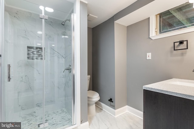 bathroom with vanity, toilet, and an enclosed shower