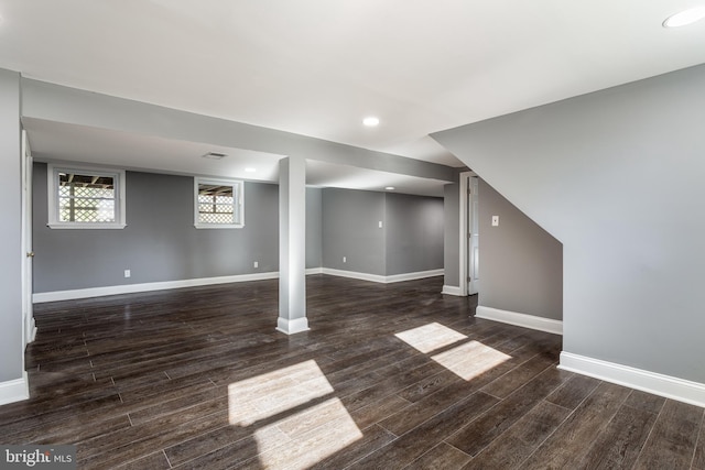 basement featuring dark hardwood / wood-style flooring