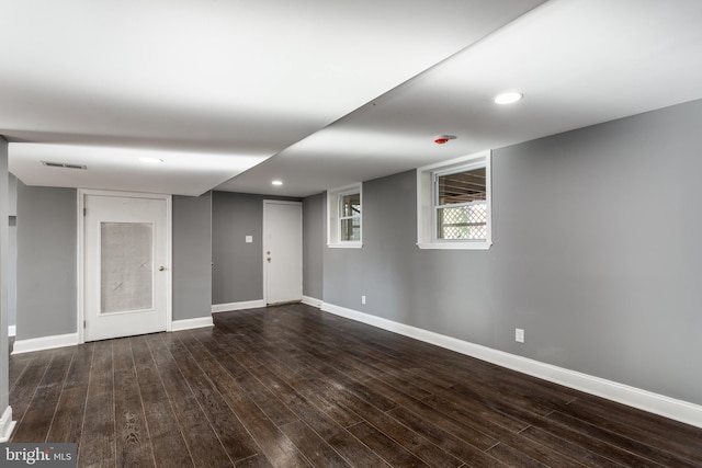 basement featuring dark wood-type flooring