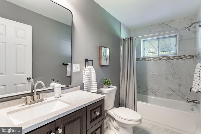 full bathroom with vanity, shower / tub combo with curtain, and toilet