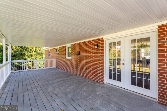 wooden deck featuring french doors