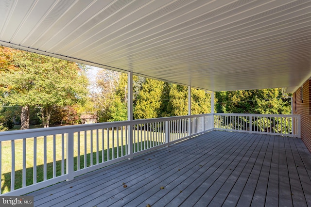 wooden terrace with a yard