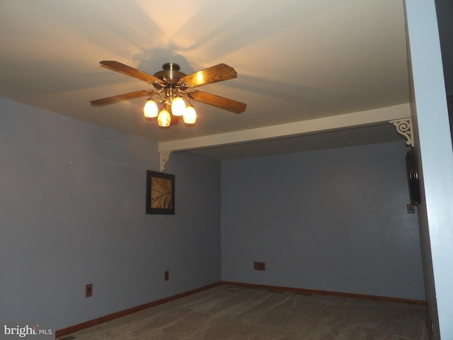 spare room featuring carpet flooring and ceiling fan