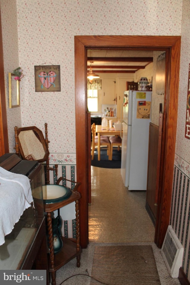 hallway with carpet floors