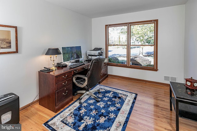 home office featuring light hardwood / wood-style floors