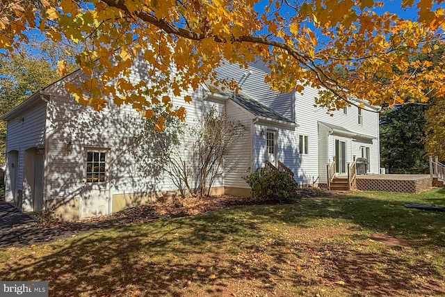 view of property exterior featuring a lawn