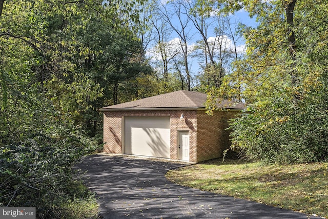 garage featuring driveway