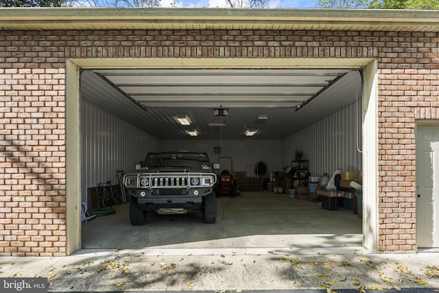 garage with aphalt driveway