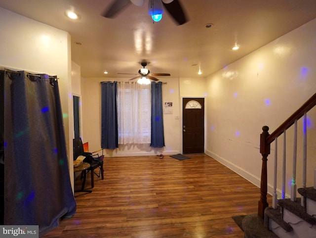 entryway featuring dark wood-type flooring and ceiling fan