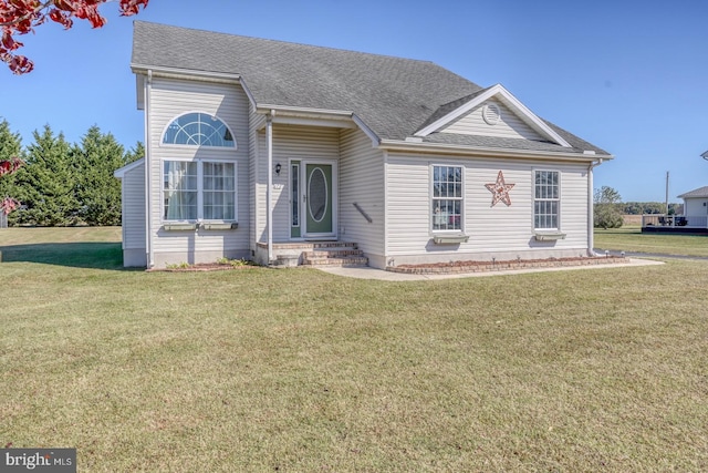 view of front of property with a front lawn