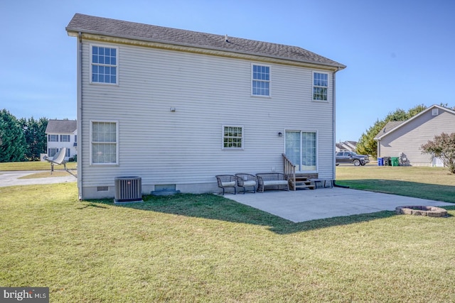 back of house with a patio, central air condition unit, and a lawn